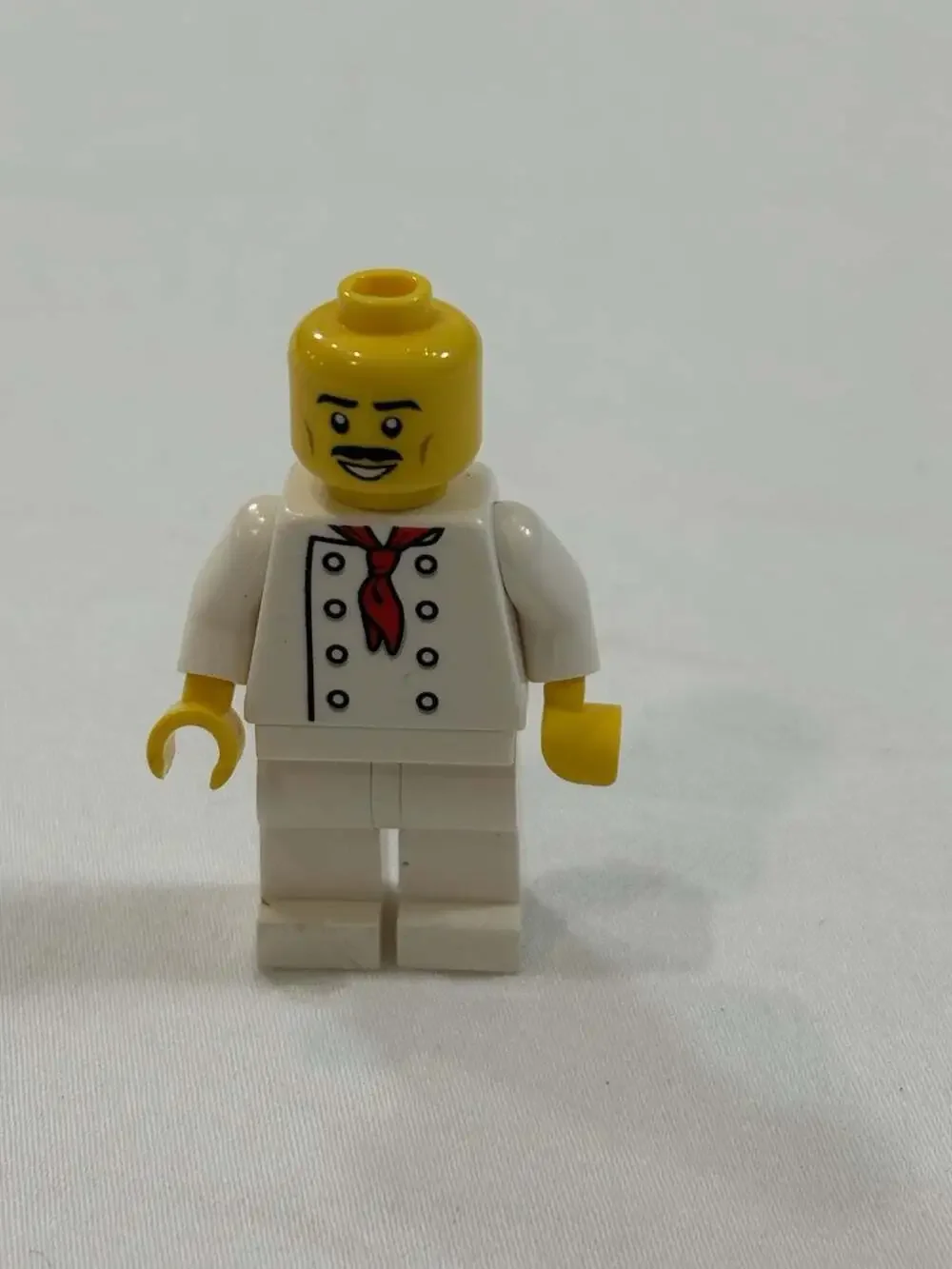 LEGO Chef minifigure featuring a white double-breasted jacket